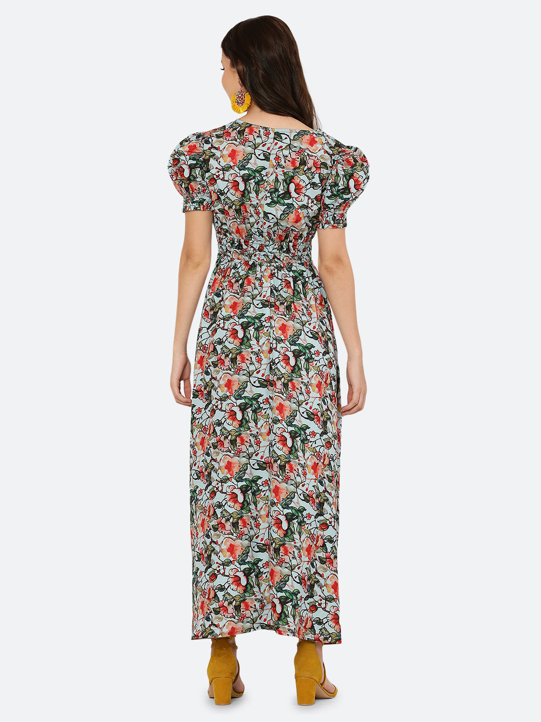 This  maxi dress features a bold print that adds a touch of sophistication to the silhouette. The rouched waist and sleeves create a flattering and feminine shape, while the attached lining provides comfort and coverage. Perfect for both formal and casual occasions, this dress can be styled with statement earrings, strappy heels, and a clutch for a chic and effortless look.