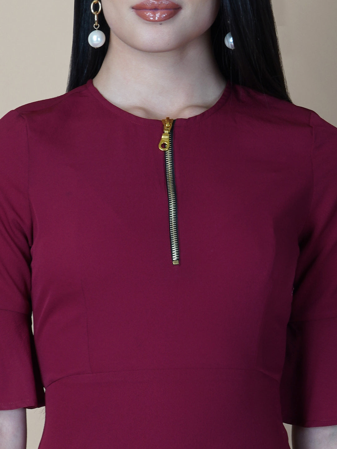 Burgundy Color A Line Women's Dress with a Metallic Zipper is a stylish and sophisticated garment that is perfect for a variety of occasions. The burgundy color is a rich and deep shade that adds a touch of elegance to the dress, while the A-line cut is flattering and comfortable.  The metallic zipper is a modern and eye-catching detail that adds a touch of edginess to the dress. It can be worn as a statement piece or paired with simple accessories to create a more subdued look.