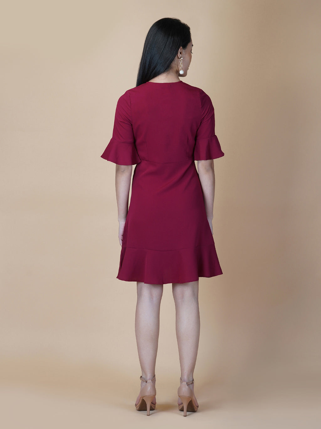 Burgundy Color A Line Women's Dress with a Metallic Zipper is a stylish and sophisticated garment that is perfect for a variety of occasions. The burgundy color is a rich and deep shade that adds a touch of elegance to the dress, while the A-line cut is flattering and comfortable.  The metallic zipper is a modern and eye-catching detail that adds a touch of edginess to the dress. It can be worn as a statement piece or paired with simple accessories to create a more subdued look.