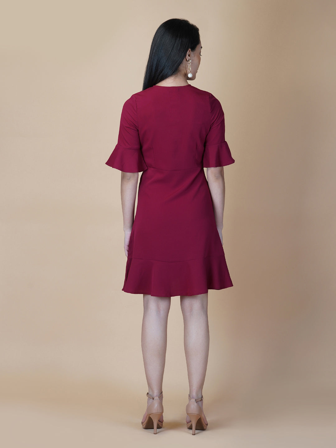Burgundy Color A Line Women's Dress with a Metallic Zipper is a stylish and sophisticated garment that is perfect for a variety of occasions. The burgundy color is a rich and deep shade that adds a touch of elegance to the dress, while the A-line cut is flattering and comfortable.  The metallic zipper is a modern and eye-catching detail that adds a touch of edginess to the dress. It can be worn as a statement piece or paired with simple accessories to create a more subdued look.