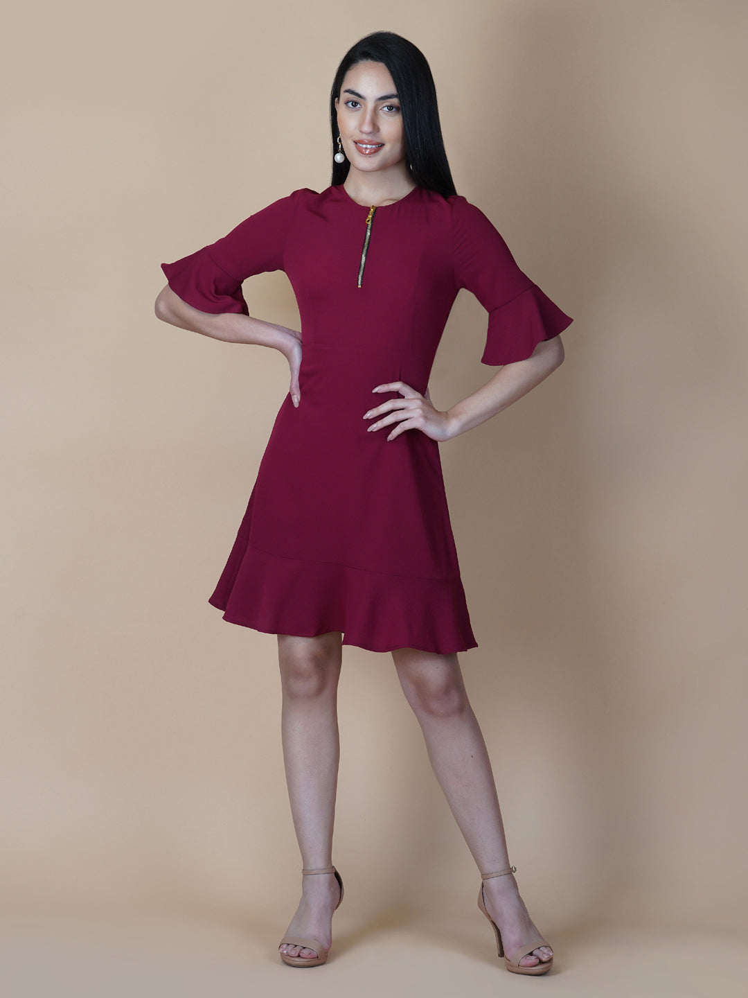 Burgundy Color A Line Women's Dress with a Metallic Zipper is a stylish and sophisticated garment that is perfect for a variety of occasions. The burgundy color is a rich and deep shade that adds a touch of elegance to the dress, while the A-line cut is flattering and comfortable.  The metallic zipper is a modern and eye-catching detail that adds a touch of edginess to the dress. It can be worn as a statement piece or paired with simple accessories to create a more subdued look.