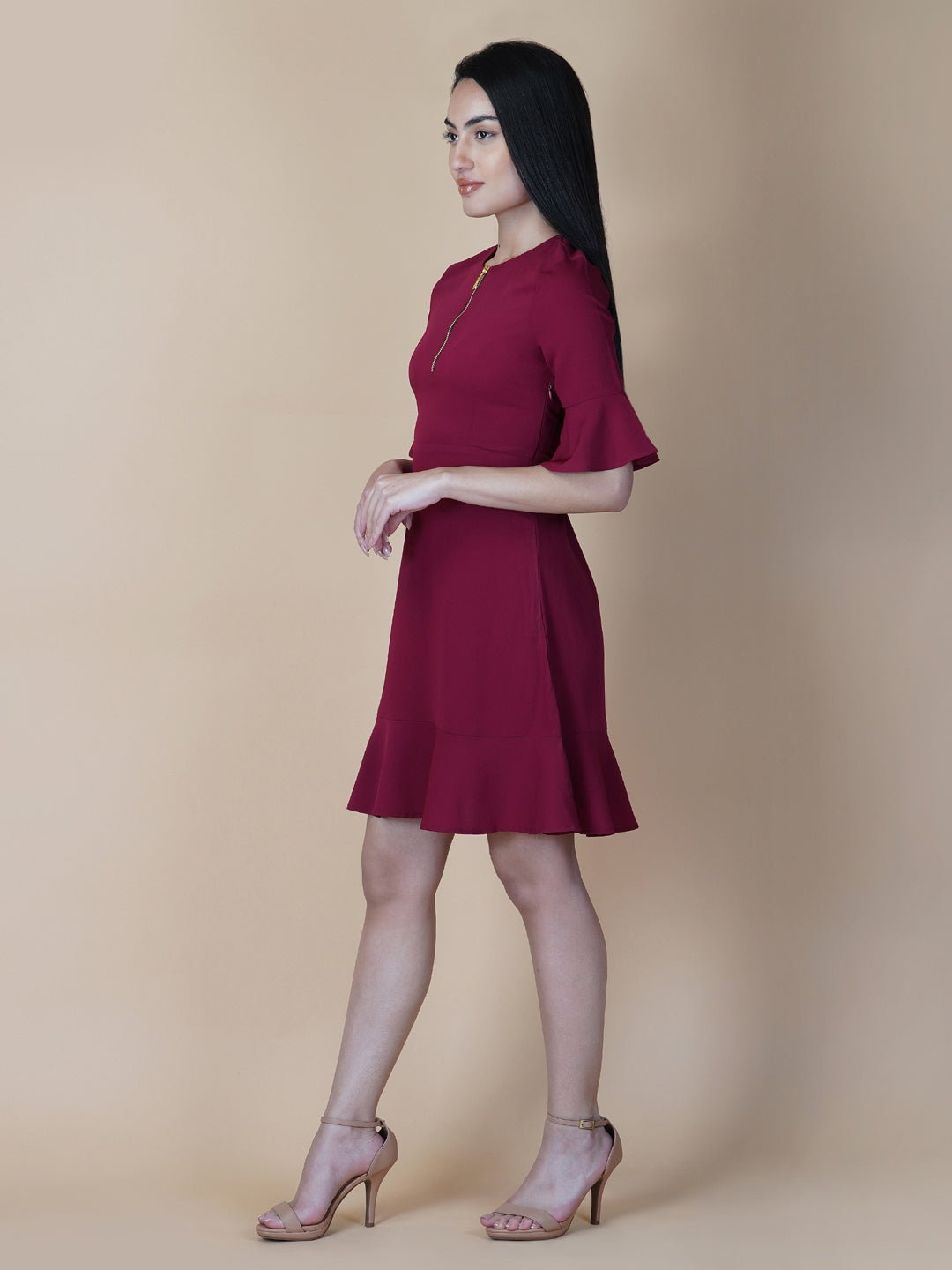 Burgundy Color A Line Women's Dress with a Metallic Zipper is a stylish and sophisticated garment that is perfect for a variety of occasions. The burgundy color is a rich and deep shade that adds a touch of elegance to the dress, while the A-line cut is flattering and comfortable.  The metallic zipper is a modern and eye-catching detail that adds a touch of edginess to the dress. It can be worn as a statement piece or paired with simple accessories to create a more subdued look.