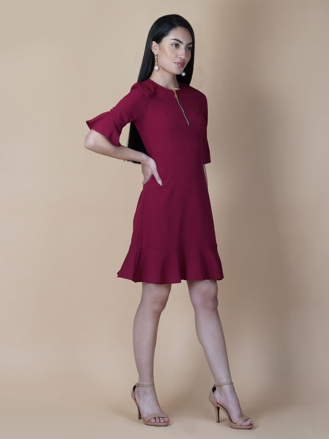 Burgundy Color A Line Women's Dress with a Metallic Zipper is a stylish and sophisticated garment that is perfect for a variety of occasions. The burgundy color is a rich and deep shade that adds a touch of elegance to the dress, while the A-line cut is flattering and comfortable.  The metallic zipper is a modern and eye-catching detail that adds a touch of edginess to the dress. It can be worn as a statement piece or paired with simple accessories to create a more subdued look.