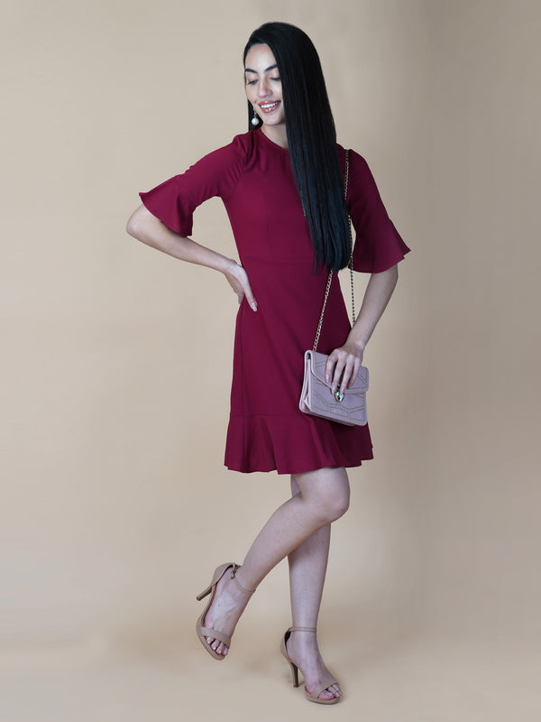 Burgundy Color A Line Women's Dress with a Metallic Zipper is a stylish and sophisticated garment that is perfect for a variety of occasions. The burgundy color is a rich and deep shade that adds a touch of elegance to the dress, while the A-line cut is flattering and comfortable.  The metallic zipper is a modern and eye-catching detail that adds a touch of edginess to the dress. It can be worn as a statement piece or paired with simple accessories to create a more subdued look.