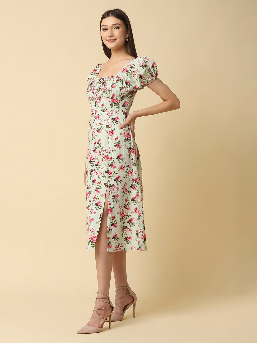 This green floral Printed Women Dress In Cotton is a charming and elegant piece that is sure to catch the eye. Made from soft and breathable cotton fabric, it is perfect for warm weather and will keep you comfortable all day long. The dress features a beautiful floral print in shades of pink, white, and green that adds a pop of color to your wardrobe.  The ruched bust and empire waist create a flattering silhouette that accentuates your curves and adds a feminine touch to the dress. 