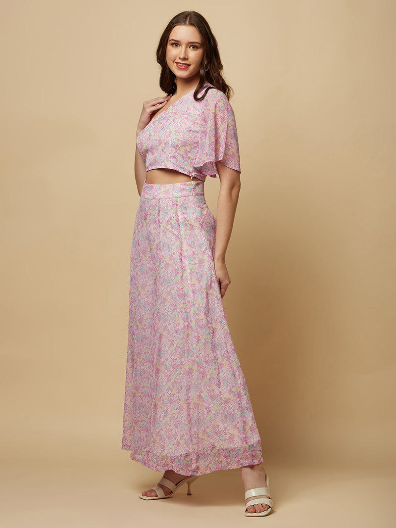 This fashionable co-ord set features a stunning purple floral print, making it the perfect addition to any fashion-forward woman's wardrobe. The set includes a trendy one-shoulder crop top and a pair of flowing palazzo pants.  The top is designed with a single shoulder strap, which adds an edgy and modern touch to the overall look. It also features a fitted bodice, which flatters the silhouette and accentuates the curves.