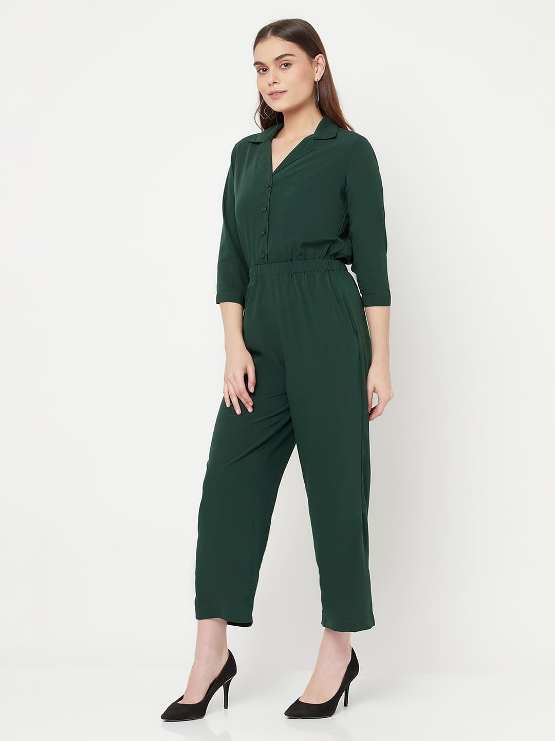 This Green color solid jump suit for women with an elasticated waist is a versatile and stylish piece of clothing that can be dressed up or down for any occasion. It is made of a comfortable and stretchy material that allows for ease of movement, while the elasticated waistband helps to flatter the figure and create a flattering silhouette.