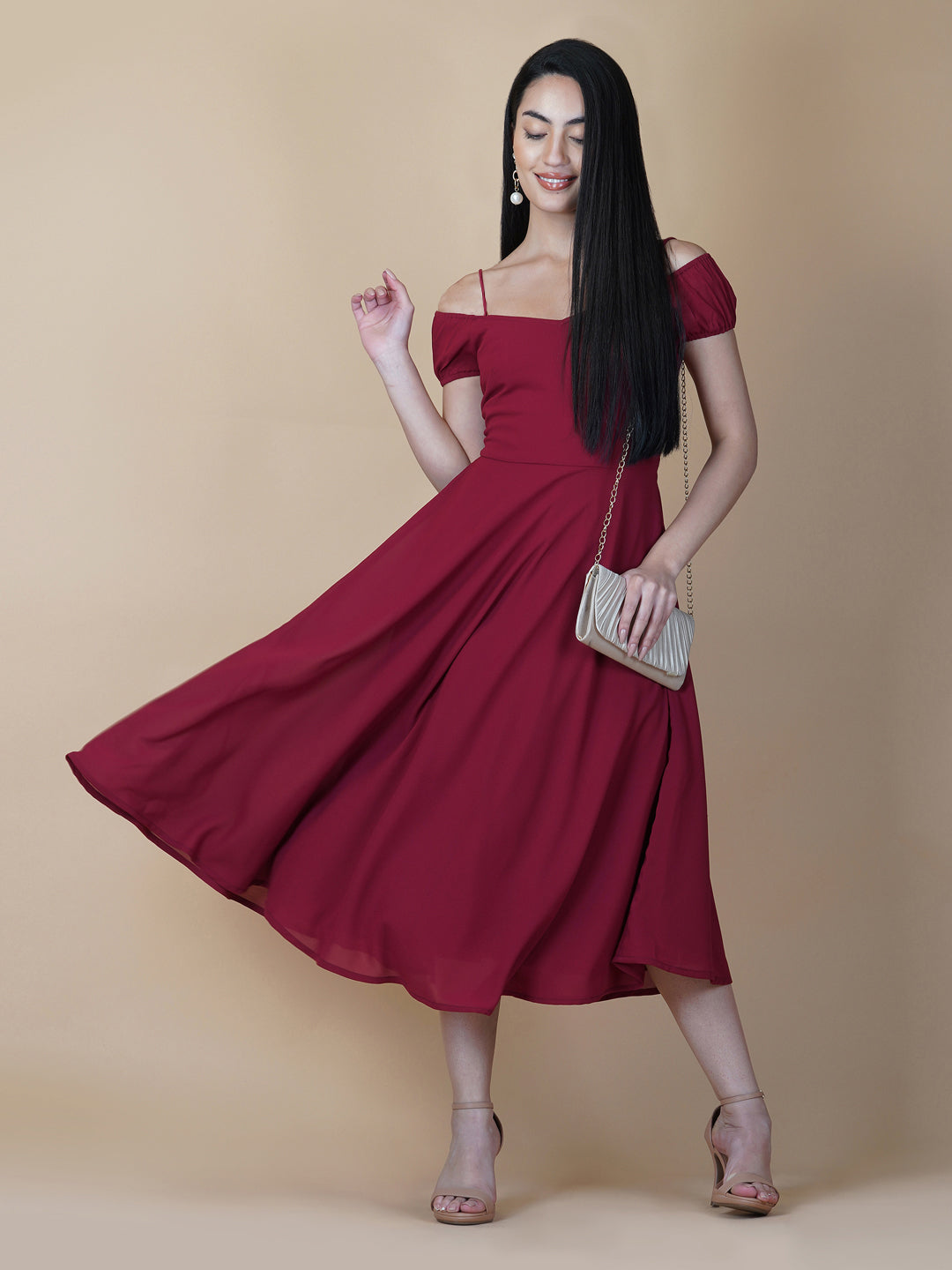 This dress features an off-shoulder neckline, a solid red color, and a circular hemline. The dress typically comes with an attached lining that provides coverage and support, while the circular hemline creates a flowy and elegant look.  The off-shoulder neckline is designed to showcase the shoulders and collarbone, creating a feminine and romantic look. The circular hemline adds movement and fluidity to the dress, making it perfect for dancing or twirling.