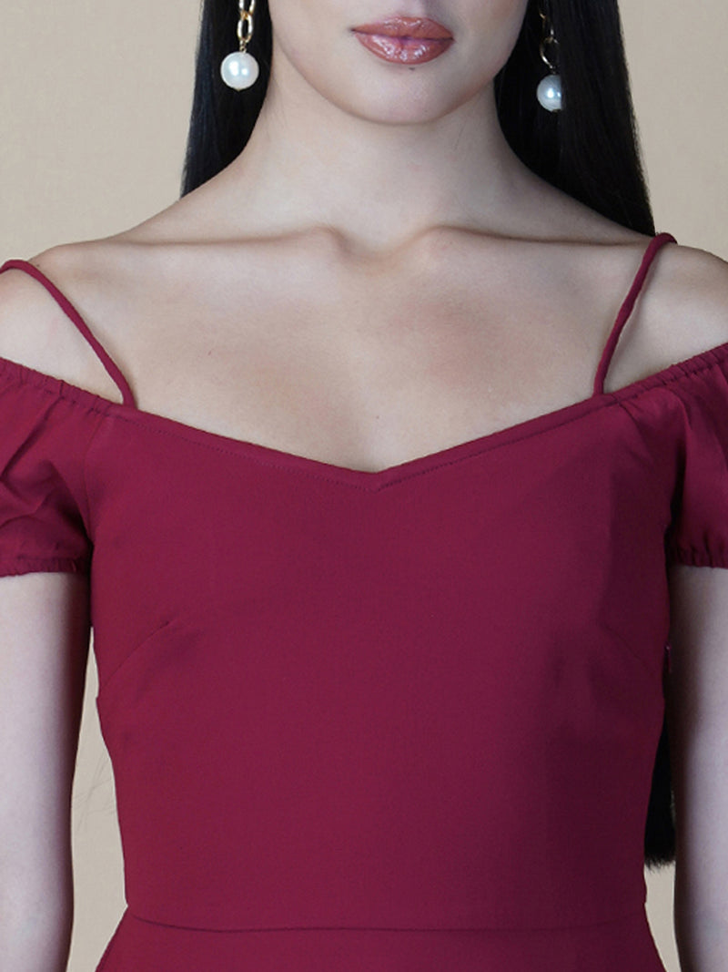 This dress features an off-shoulder neckline, a solid red color, and a circular hemline. The dress typically comes with an attached lining that provides coverage and support, while the circular hemline creates a flowy and elegant look.  The off-shoulder neckline is designed to showcase the shoulders and collarbone, creating a feminine and romantic look. The circular hemline adds movement and fluidity to the dress, making it perfect for dancing or twirling.