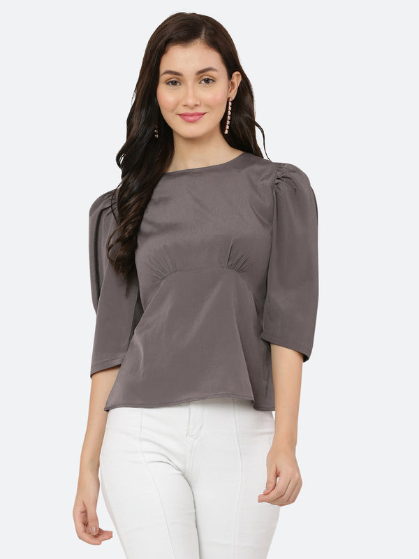 A ruched waist women's top typically features gathering or pleating at the waistline, which creates a snug and flattering fit. The top may be made from a variety of fabrics and come in different colors, but the grey color is a popular choice.