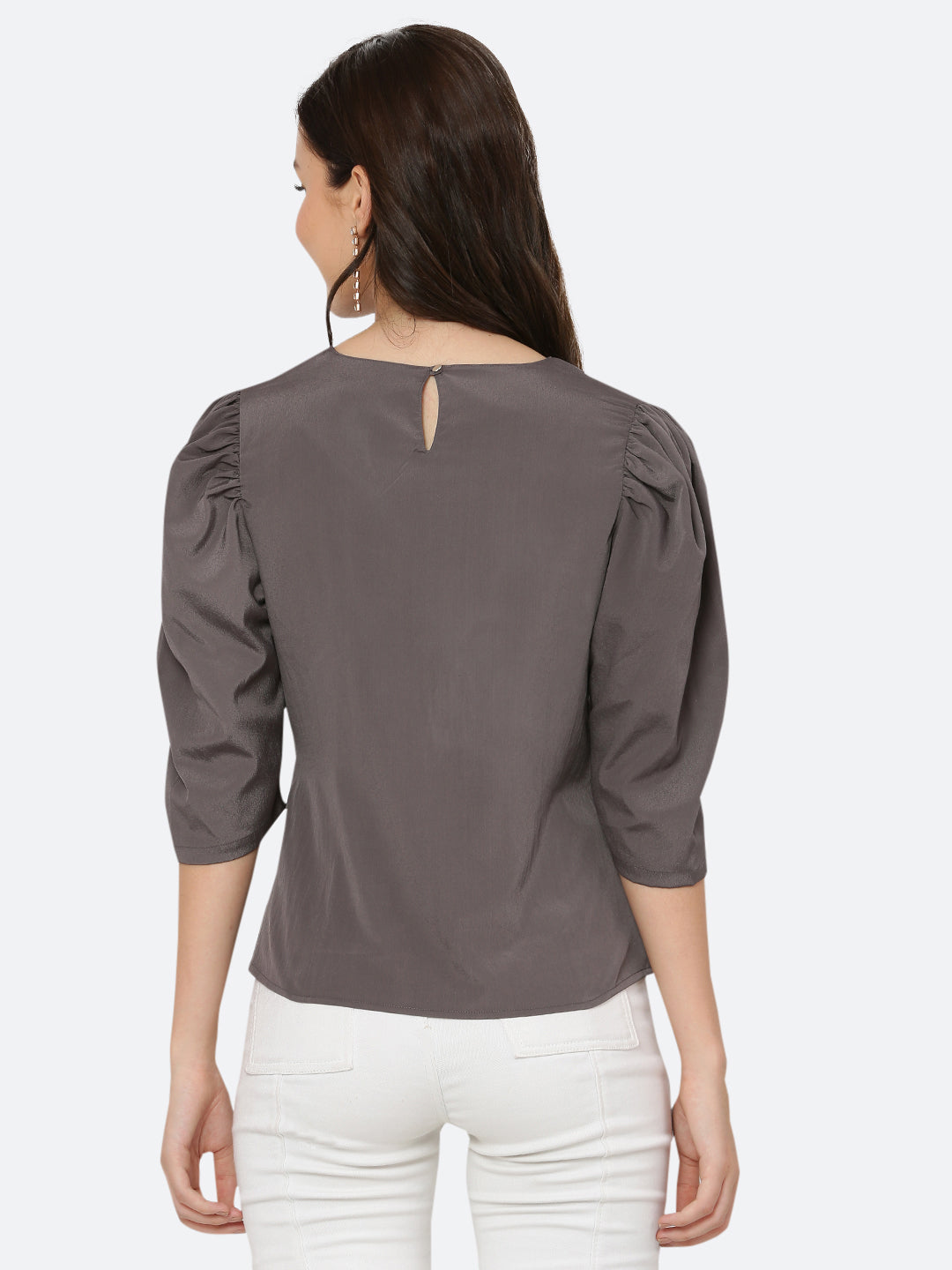 A ruched waist women's top typically features gathering or pleating at the waistline, which creates a snug and flattering fit. The top may be made from a variety of fabrics and come in different colors, but the grey color is a popular choice.