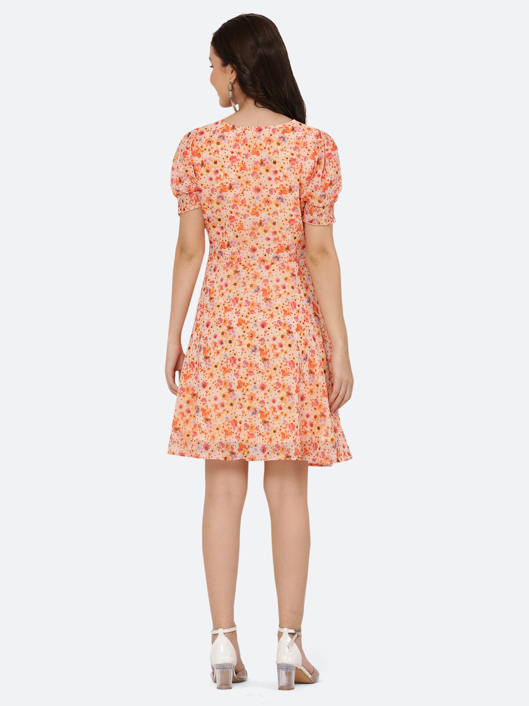 This dress features a circular hemline that adds a playful, flirty feel to the overall design. The ruched neckline and smocked sleeves add texture and dimension to the dress, while also providing a snug and comfortable fit. Perfect for summer days and breezy evenings, this dress is versatile and easy to wear, making it a must-have in your wardrobe.