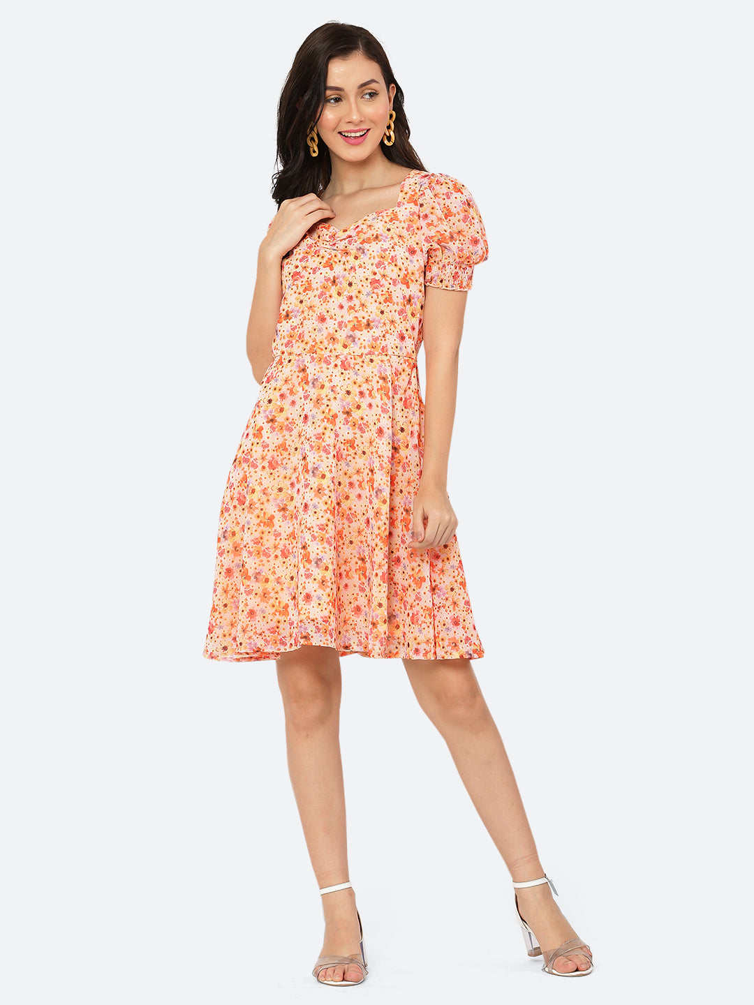 This dress features a circular hemline that adds a playful, flirty feel to the overall design. The ruched neckline and smocked sleeves add texture and dimension to the dress, while also providing a snug and comfortable fit. Perfect for summer days and breezy evenings, this dress is versatile and easy to wear, making it a must-have in your wardrobe.