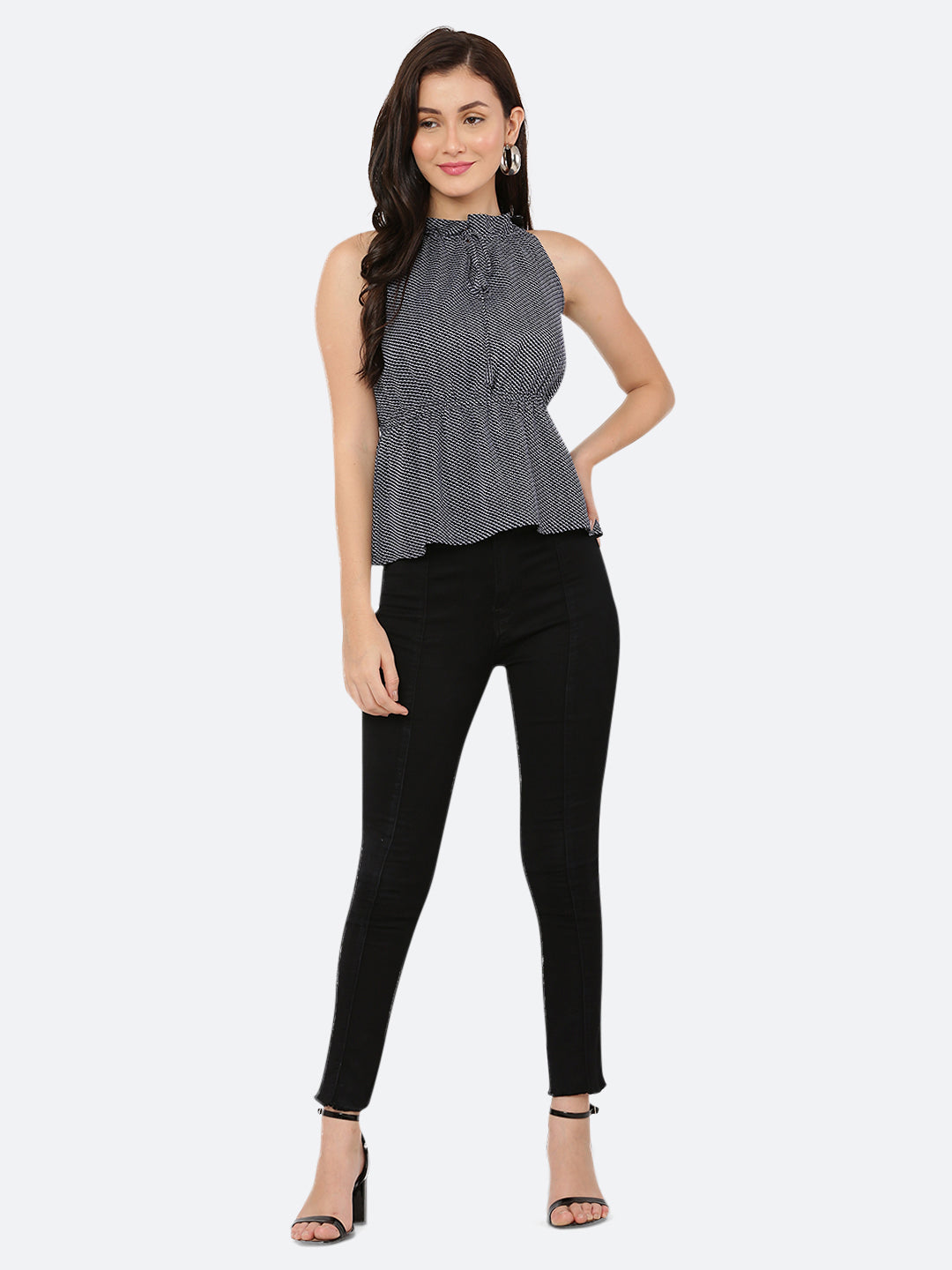 A blue printed halter neck top with a ruched waist typically refers to a sleeveless top that has a high neckline that ties at the back of the neck, leaving the shoulders and upper back exposed. The top is often fitted around the bust and waist, with ruching or gathering at the waistline to create a flattering and feminine silhouette.
