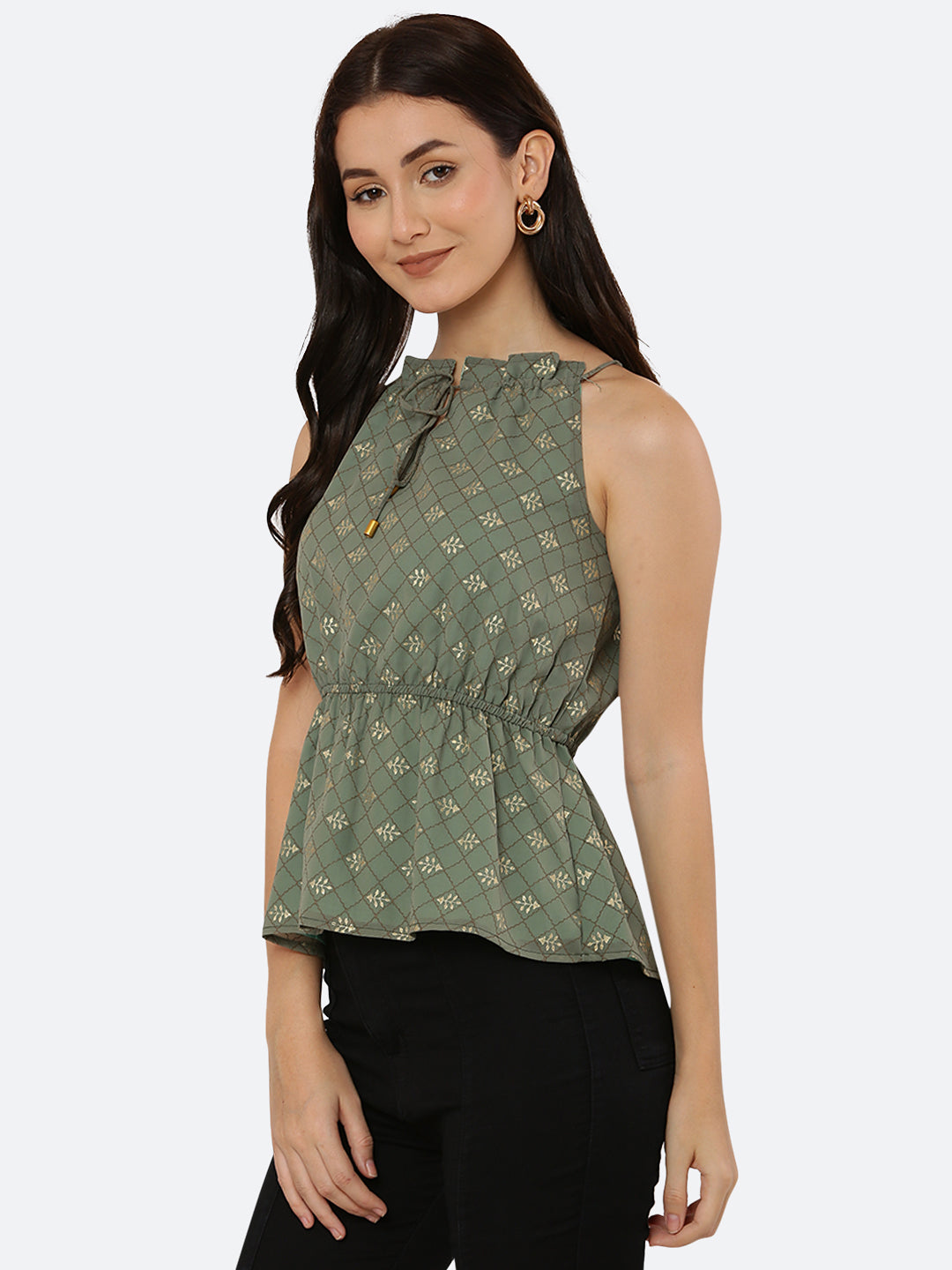Green Foil printed halter neck top for women with a ruched waist and drawstring is a stylish and versatile piece of clothing. The halter neck design creates a flattering silhouette by accentuating the shoulders and neckline while the ruched waistline cinches in the waist and creates an hourglass shape. The drawstring allows for a customizable fit, making this top suitable for a range of body types.