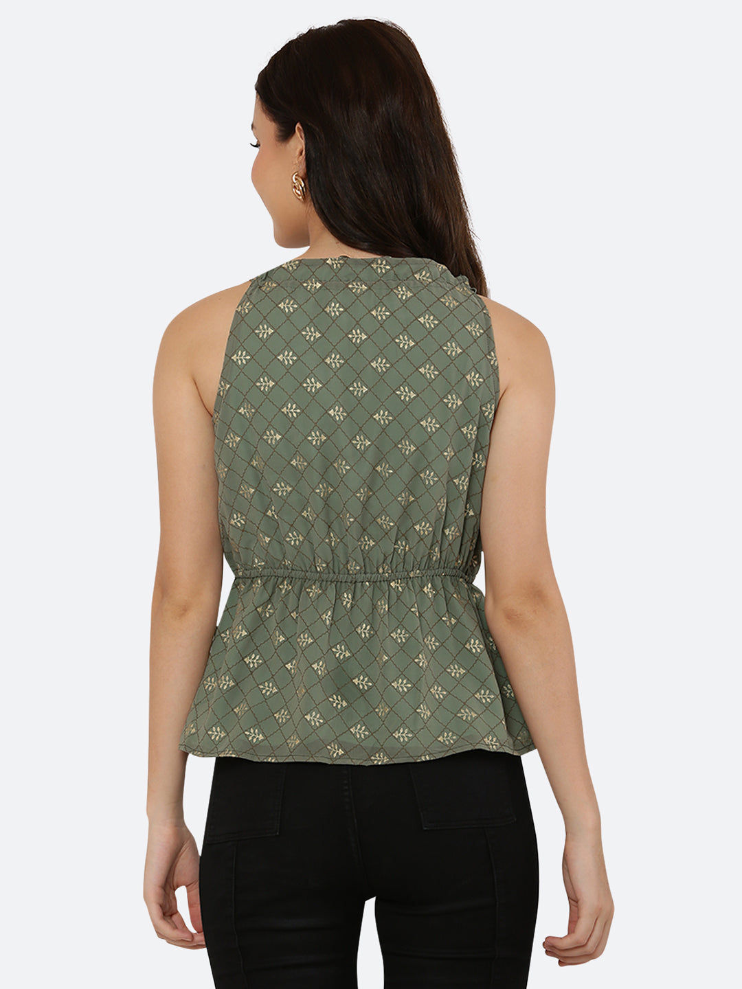 Green Foil printed halter neck top for women with a ruched waist and drawstring is a stylish and versatile piece of clothing. The halter neck design creates a flattering silhouette by accentuating the shoulders and neckline while the ruched waistline cinches in the waist and creates an hourglass shape. The drawstring allows for a customizable fit, making this top suitable for a range of body types.