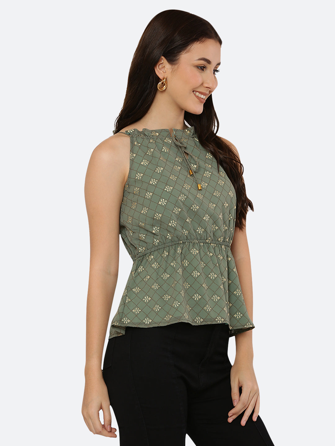 Green Foil printed halter neck top for women with a ruched waist and drawstring is a stylish and versatile piece of clothing. The halter neck design creates a flattering silhouette by accentuating the shoulders and neckline while the ruched waistline cinches in the waist and creates an hourglass shape. The drawstring allows for a customizable fit, making this top suitable for a range of body types.