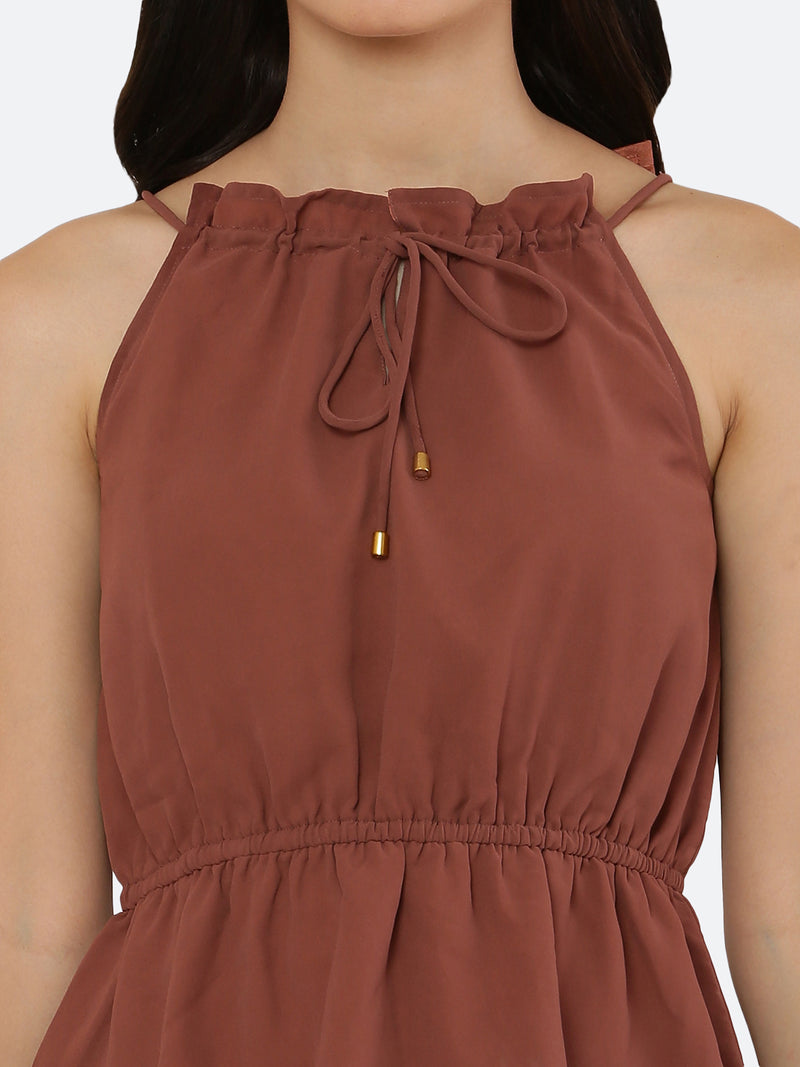 A Solid Brown Color Halter Neckline Top with drawstring and ruched waist is a stylish and versatile piece of clothing that can be dressed up or down depending on the occasion. The halter neckline creates an elegant and feminine look, while the drawstring and ruched waist add a touch of detail and texture to the top.