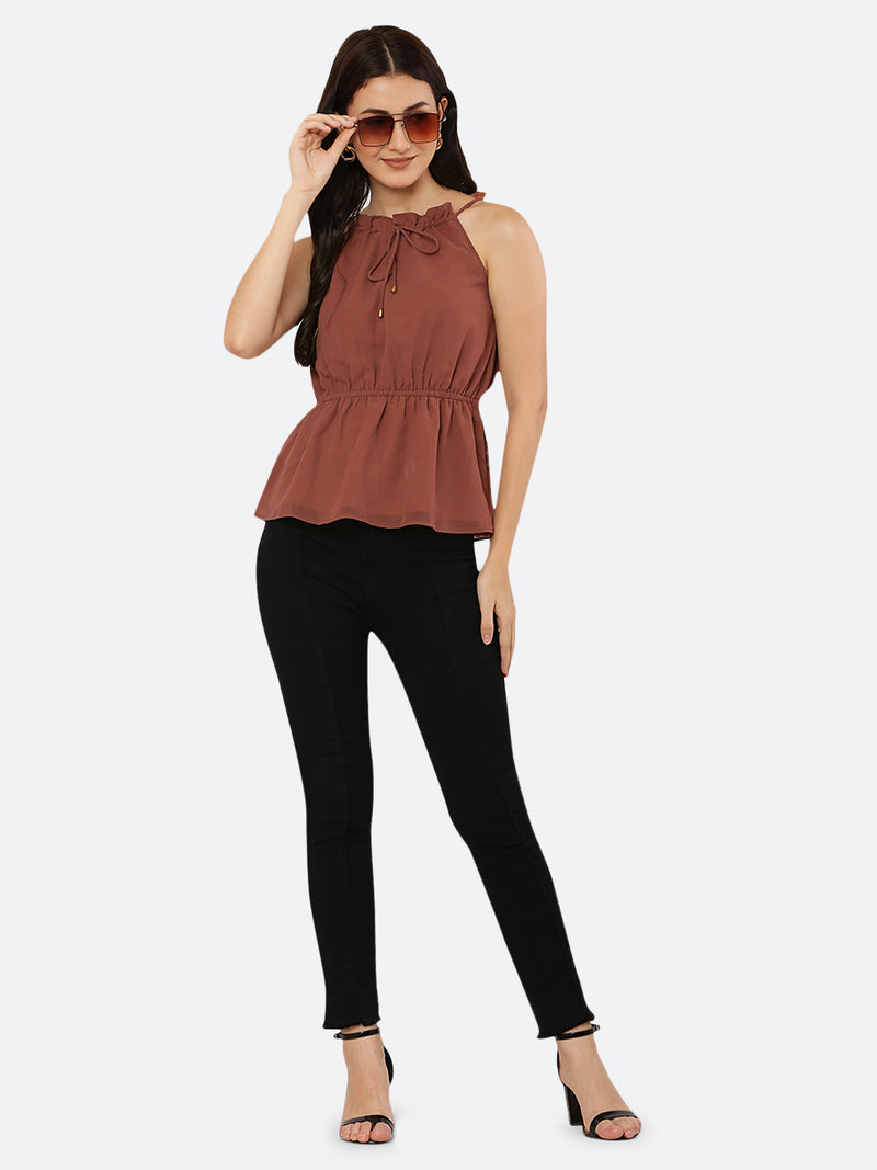 A Solid Brown Color Halter Neckline Top with drawstring and ruched waist is a stylish and versatile piece of clothing that can be dressed up or down depending on the occasion. The halter neckline creates an elegant and feminine look, while the drawstring and ruched waist add a touch of detail and texture to the top.