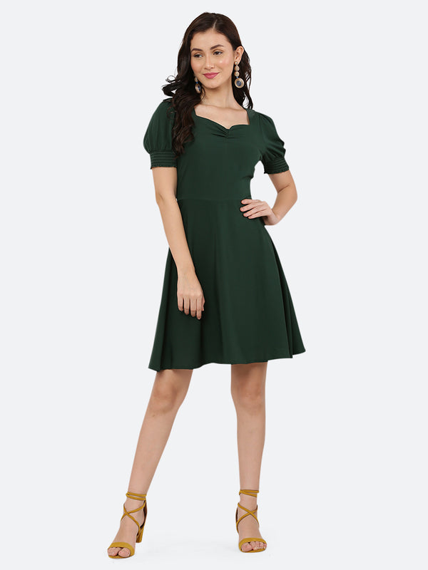 This dress features a circular hemline that adds a playful, flirty feel to the overall design. The ruched neckline and smocked sleeves add texture and dimension to the dress, while also providing a snug and comfortable fit. Perfect for summer days and breezy evenings, this dress is versatile and easy to wear, making it a must-have in your wardrobe.