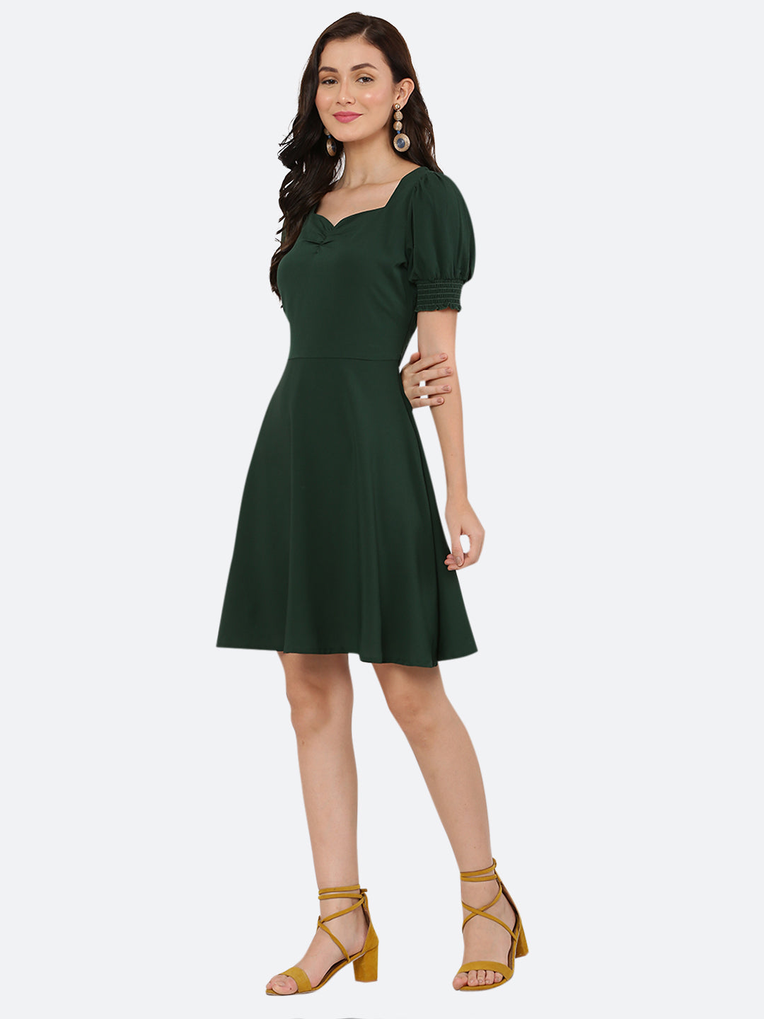 This dress features a circular hemline that adds a playful, flirty feel to the overall design. The ruched neckline and smocked sleeves add texture and dimension to the dress, while also providing a snug and comfortable fit. Perfect for summer days and breezy evenings, this dress is versatile and easy to wear, making it a must-have in your wardrobe.