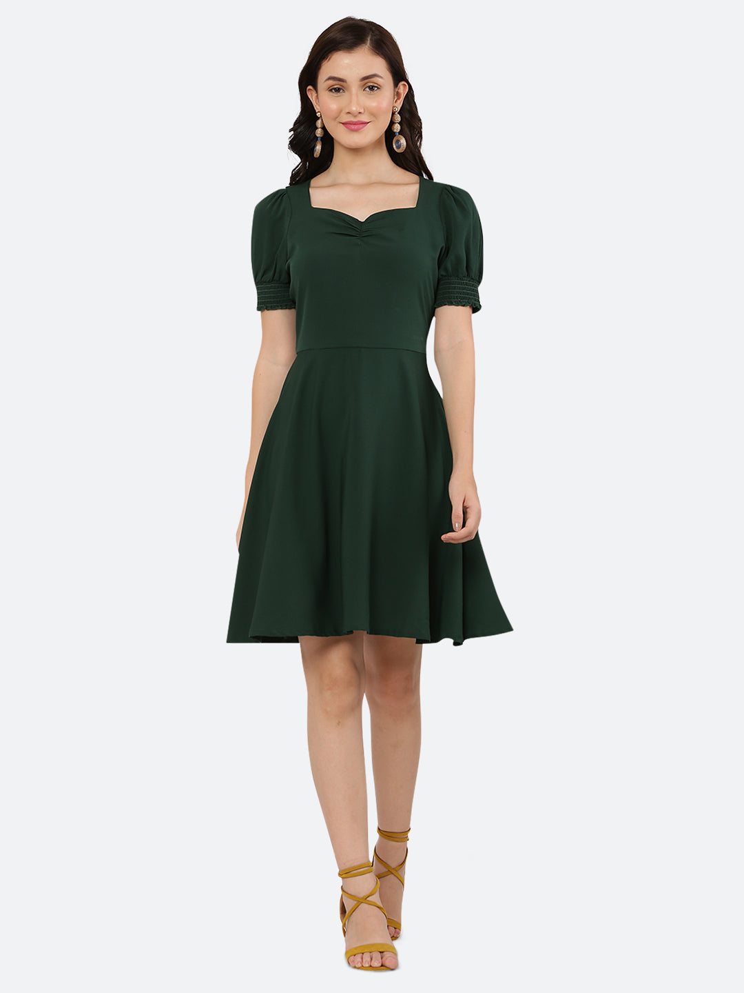 This dress features a circular hemline that adds a playful, flirty feel to the overall design. The ruched neckline and smocked sleeves add texture and dimension to the dress, while also providing a snug and comfortable fit. Perfect for summer days and breezy evenings, this dress is versatile and easy to wear, making it a must-have in your wardrobe.