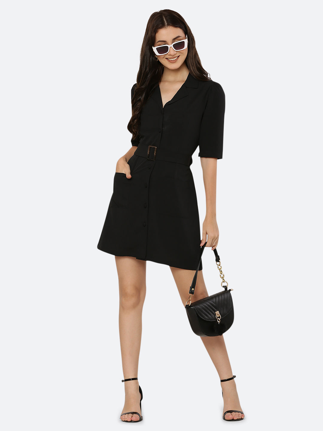 This short dress is the perfect combination of sophistication and style. The tailored collar adds a touch of elegance while the belt cinches in at the waist to create a flattering silhouette. The solid color makes it versatile and easy to pair with various accessories. Wear it to a summer barbecue or dress it up for a night out on the town. This dress is a must-have for any fashionista's wardrobe.