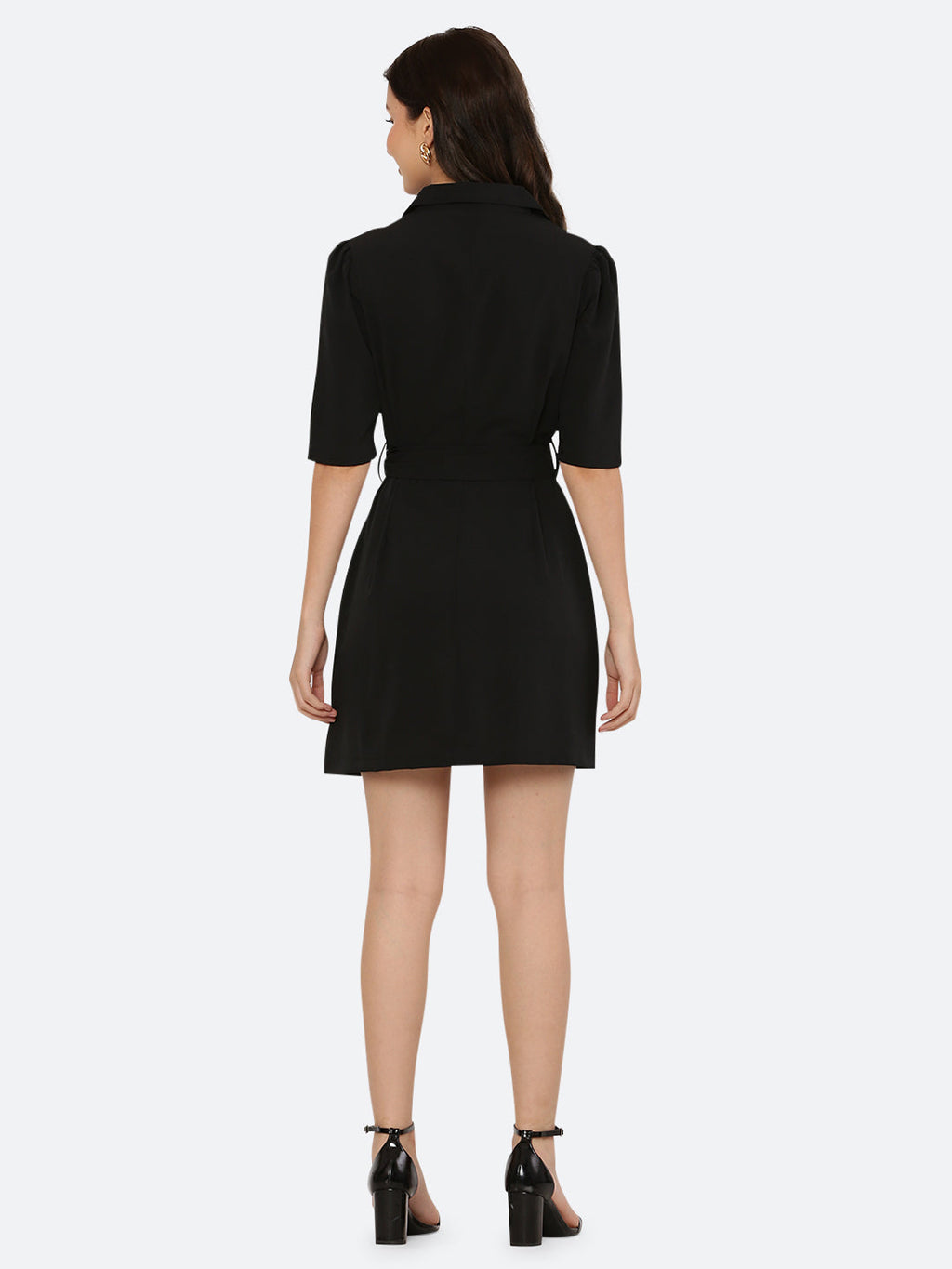 This short dress is the perfect combination of sophistication and style. The tailored collar adds a touch of elegance while the belt cinches in at the waist to create a flattering silhouette. The solid color makes it versatile and easy to pair with various accessories. Wear it to a summer barbecue or dress it up for a night out on the town. This dress is a must-have for any fashionista's wardrobe.