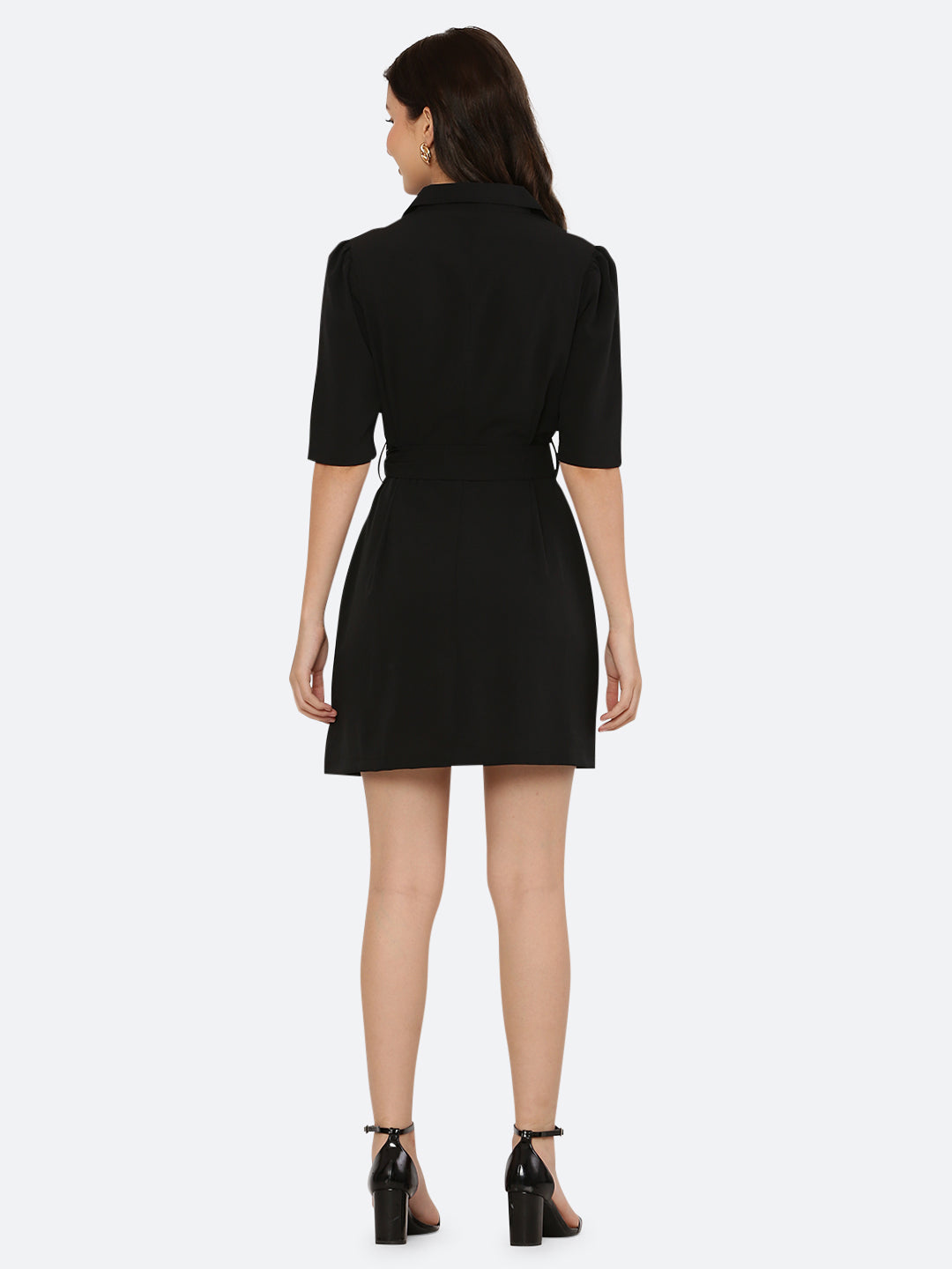 This short dress is the perfect combination of sophistication and style. The tailored collar adds a touch of elegance while the belt cinches in at the waist to create a flattering silhouette. The solid color makes it versatile and easy to pair with various accessories. Wear it to a summer barbecue or dress it up for a night out on the town. This dress is a must-have for any fashionista's wardrobe.