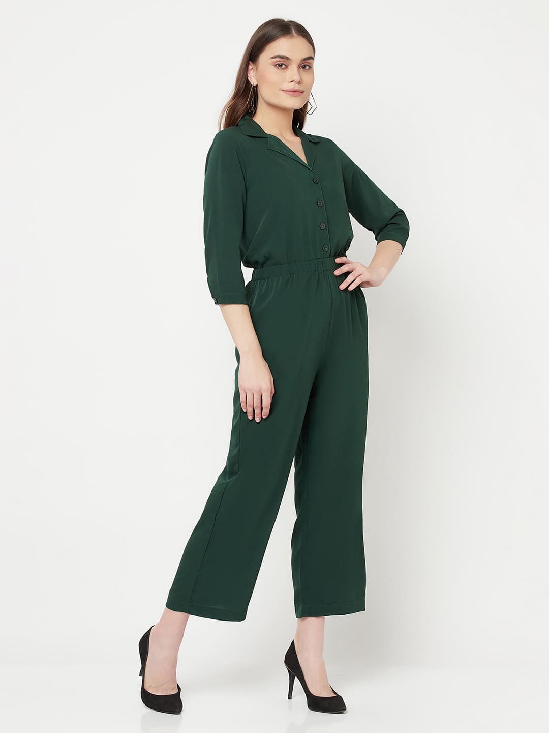 This Green color solid jump suit for women with an elasticated waist is a versatile and stylish piece of clothing that can be dressed up or down for any occasion. It is made of a comfortable and stretchy material that allows for ease of movement, while the elasticated waistband helps to flatter the figure and create a flattering silhouette.