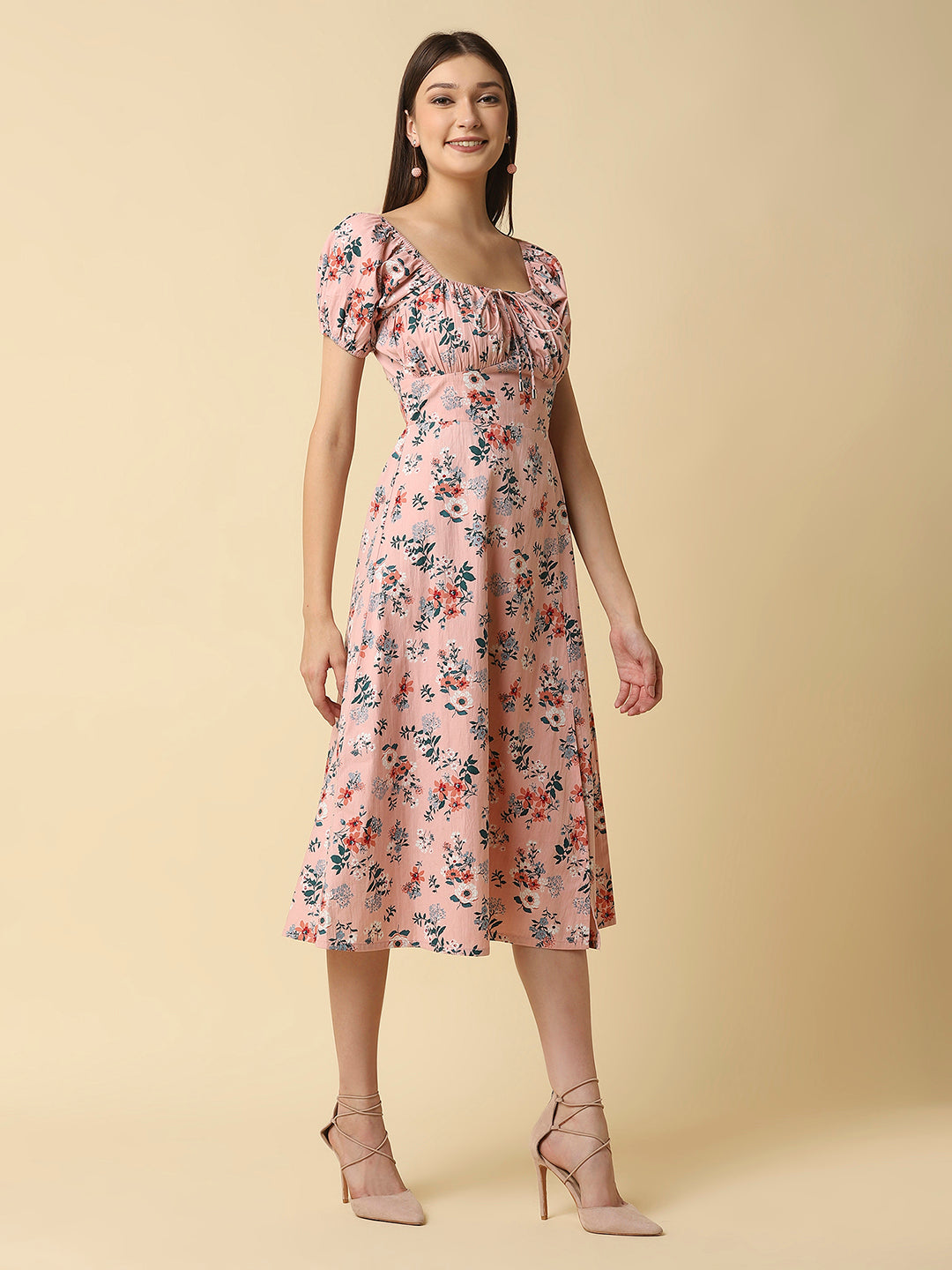 This Pink Floral Printed Women Dress In Cotton is a charming and elegant piece that is sure to catch the eye. Made from soft and breathable cotton fabric, it is perfect for warm weather and will keep you comfortable all day long. The dress features a beautiful floral print in shades of pink, white, and green that adds a pop of color to your wardrobe.