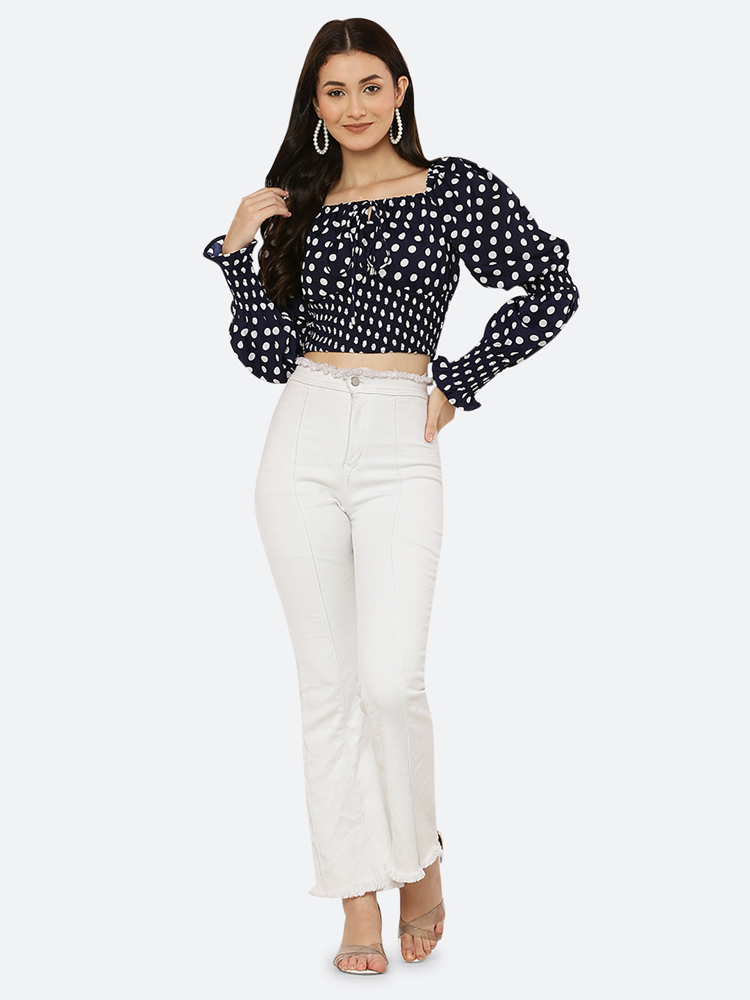 Blue polka dot smocked crop top for women is a trendy and stylish garment that features a fitted and stretchy smocked bodice, with a cropped hem that sits above the waistline. The top is adorned with small polka dots that add a playful and feminine touch.  This type of top is versatile and can be styled in a variety of ways. 