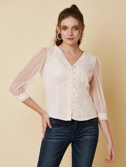This pink mesh top features a front button closure, allowing for easy wear and a stylish look. The mesh material adds a unique and trendy touch to the piece, while the soft pink color adds a feminine and playful feel.  This top can be dressed up or down, making it a versatile addition to any wardrobe. Pair it with a high waisted skirt for a chic look, or with jeans and sneakers for a more casual vibe.