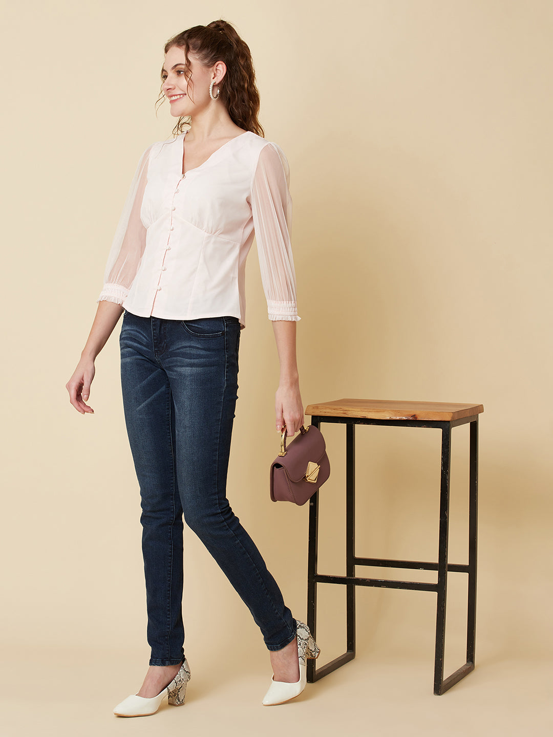 This pink mesh top features a front button closure, allowing for easy wear and a stylish look. The mesh material adds a unique and trendy touch to the piece, while the soft pink color adds a feminine and playful feel.  This top can be dressed up or down, making it a versatile addition to any wardrobe. Pair it with a high waisted skirt for a chic look, or with jeans and sneakers for a more casual vibe.