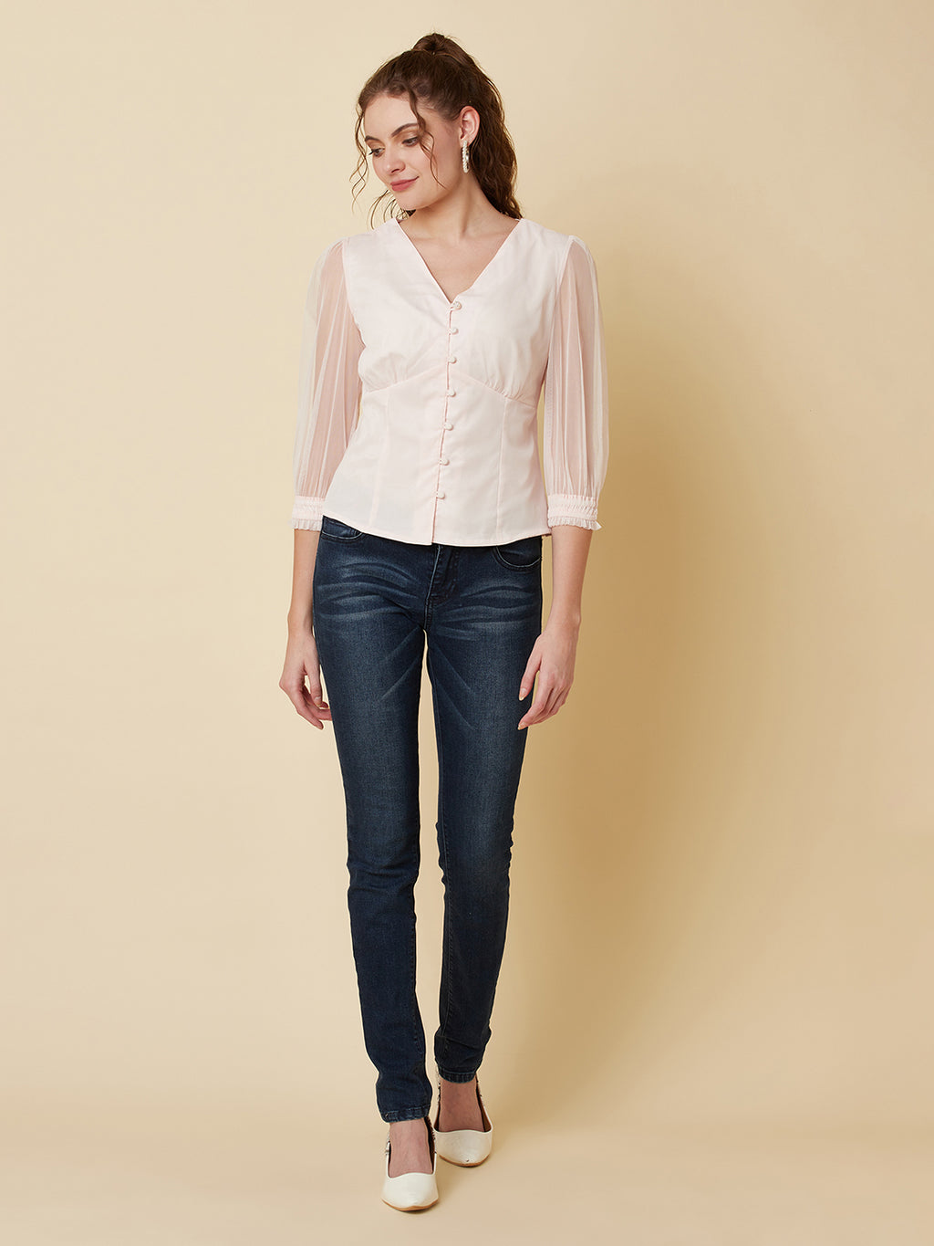 This pink mesh top features a front button closure, allowing for easy wear and a stylish look. The mesh material adds a unique and trendy touch to the piece, while the soft pink color adds a feminine and playful feel.  This top can be dressed up or down, making it a versatile addition to any wardrobe. Pair it with a high waisted skirt for a chic look, or with jeans and sneakers for a more casual vibe.