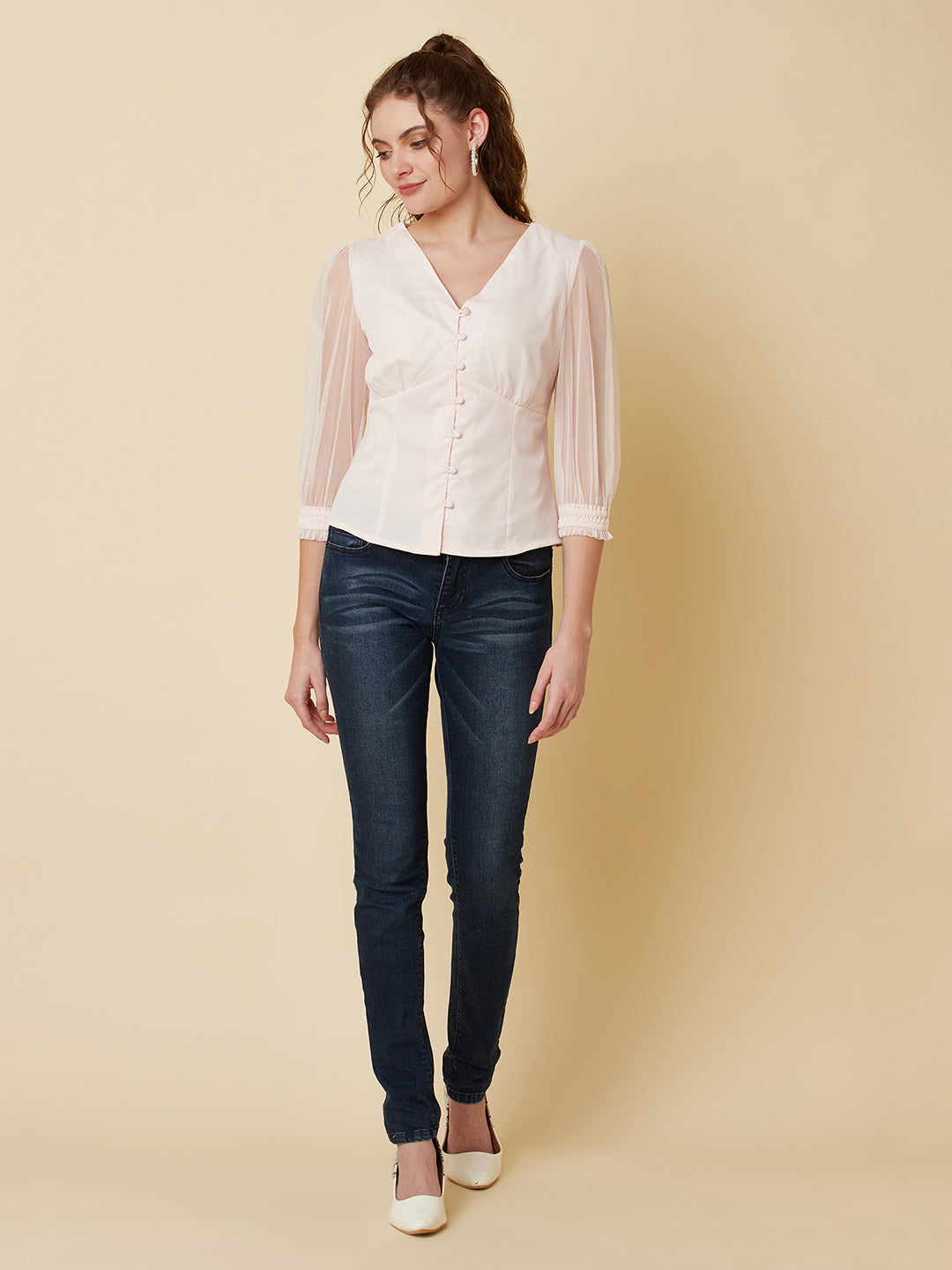 This pink mesh top features a front button closure, allowing for easy wear and a stylish look. The mesh material adds a unique and trendy touch to the piece, while the soft pink color adds a feminine and playful feel.  This top can be dressed up or down, making it a versatile addition to any wardrobe. Pair it with a high waisted skirt for a chic look, or with jeans and sneakers for a more casual vibe.