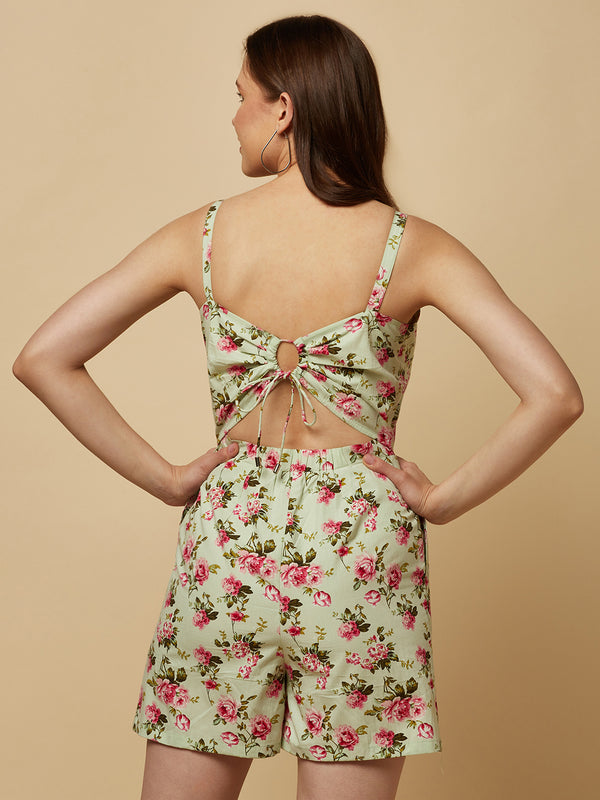 Introducing our Green Floral Printed Cotton Jumpsuit, the perfect addition to your wardrobe for any occasion! This stunning jumpsuit is crafted from high-quality cotton fabric, ensuring both comfort and durability. The eye-catching green floral print is perfect for adding a touch of spring to any outfit.  The back of the jumpsuit features a drawstring, allowing you to adjust the fit to your liking. 