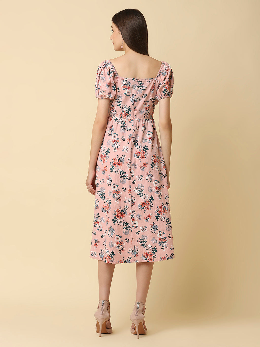 This Pink Floral Printed Women Dress In Cotton is a charming and elegant piece that is sure to catch the eye. Made from soft and breathable cotton fabric, it is perfect for warm weather and will keep you comfortable all day long. The dress features a beautiful floral print in shades of pink, white, and green that adds a pop of color to your wardrobe.