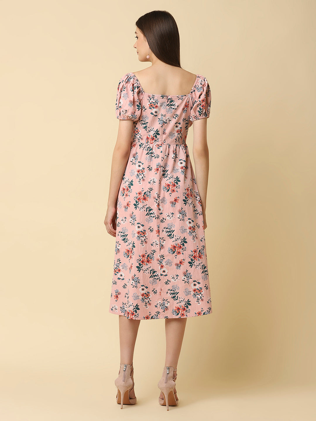 This Pink Floral Printed Women Dress In Cotton is a charming and elegant piece that is sure to catch the eye. Made from soft and breathable cotton fabric, it is perfect for warm weather and will keep you comfortable all day long. The dress features a beautiful floral print in shades of pink, white, and green that adds a pop of color to your wardrobe.