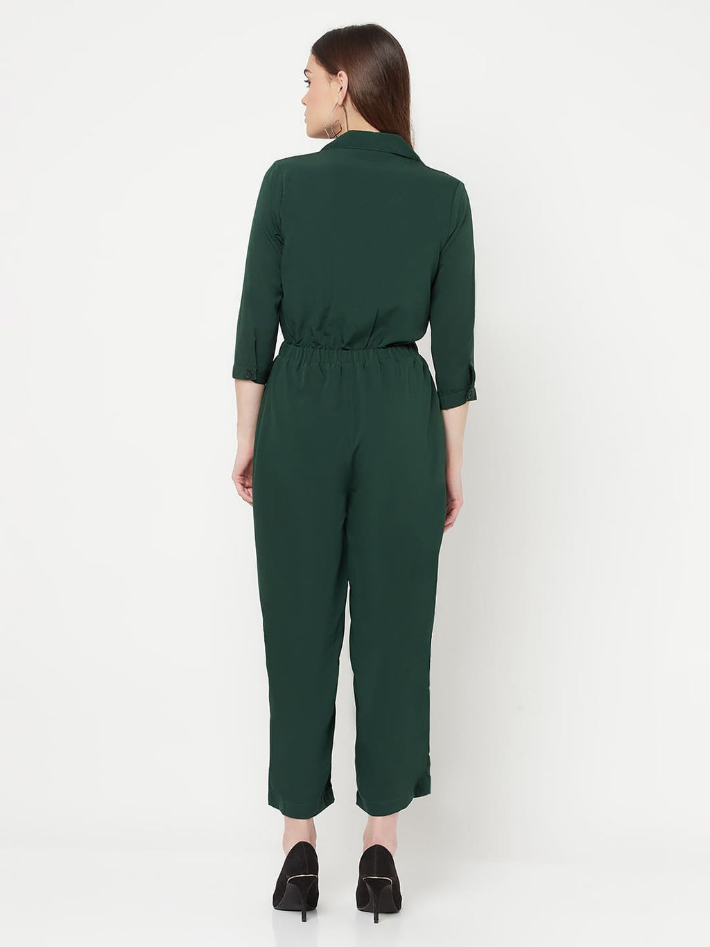 This Green color solid jump suit for women with an elasticated waist is a versatile and stylish piece of clothing that can be dressed up or down for any occasion. It is made of a comfortable and stretchy material that allows for ease of movement, while the elasticated waistband helps to flatter the figure and create a flattering silhouette.