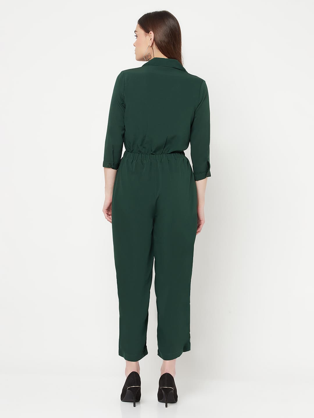 This Green color solid jump suit for women with an elasticated waist is a versatile and stylish piece of clothing that can be dressed up or down for any occasion. It is made of a comfortable and stretchy material that allows for ease of movement, while the elasticated waistband helps to flatter the figure and create a flattering silhouette.