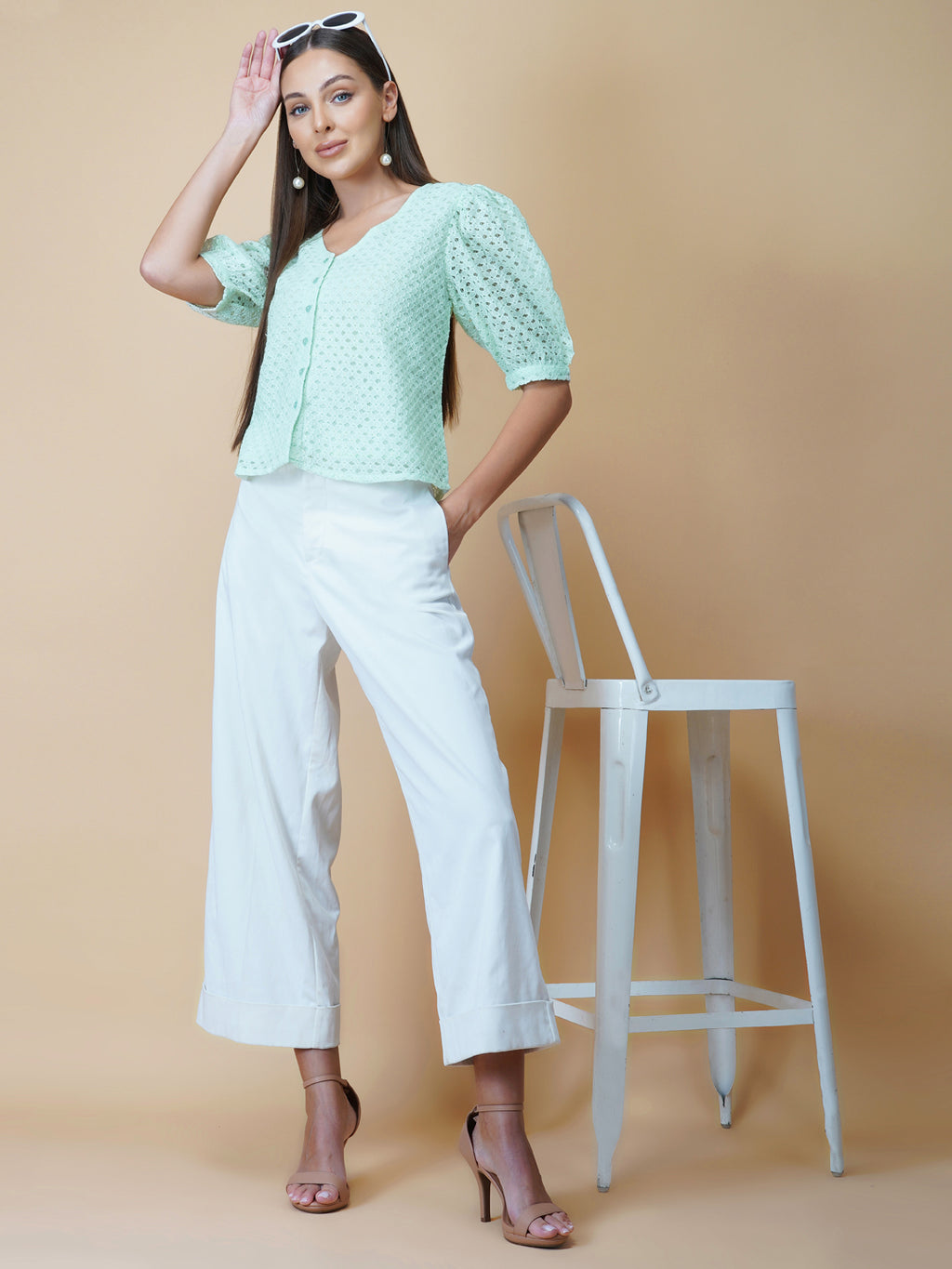The Green Color Jacquard Mesh Women Top is a versatile and stylish piece of clothing that is perfect for both formal and casual occasions. The top features a classic V-neck design that is flattering for all body types, and it is adorned with a row of front buttons that add a touch of elegance and sophistication to the overall look.  Made from good-quality jacquard mesh fabric, this top is lightweight, breathable, and comfortable to wear all day long. 