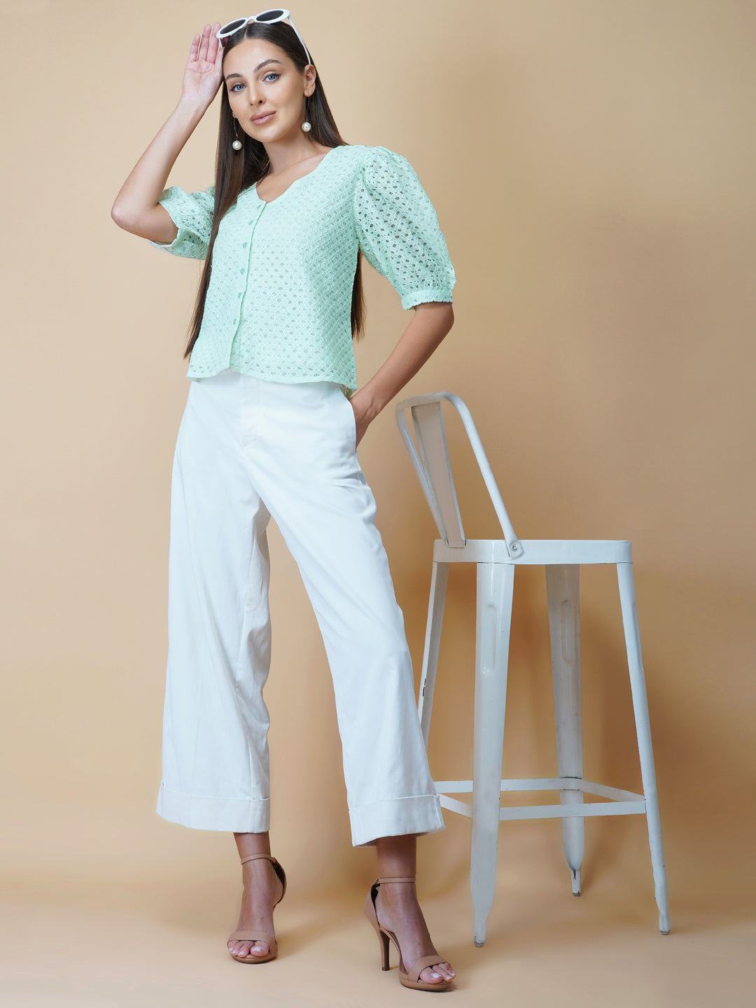 The Green Color Jacquard Mesh Women Top is a versatile and stylish piece of clothing that is perfect for both formal and casual occasions. The top features a classic V-neck design that is flattering for all body types, and it is adorned with a row of front buttons that add a touch of elegance and sophistication to the overall look.  Made from good-quality jacquard mesh fabric, this top is lightweight, breathable, and comfortable to wear all day long. 