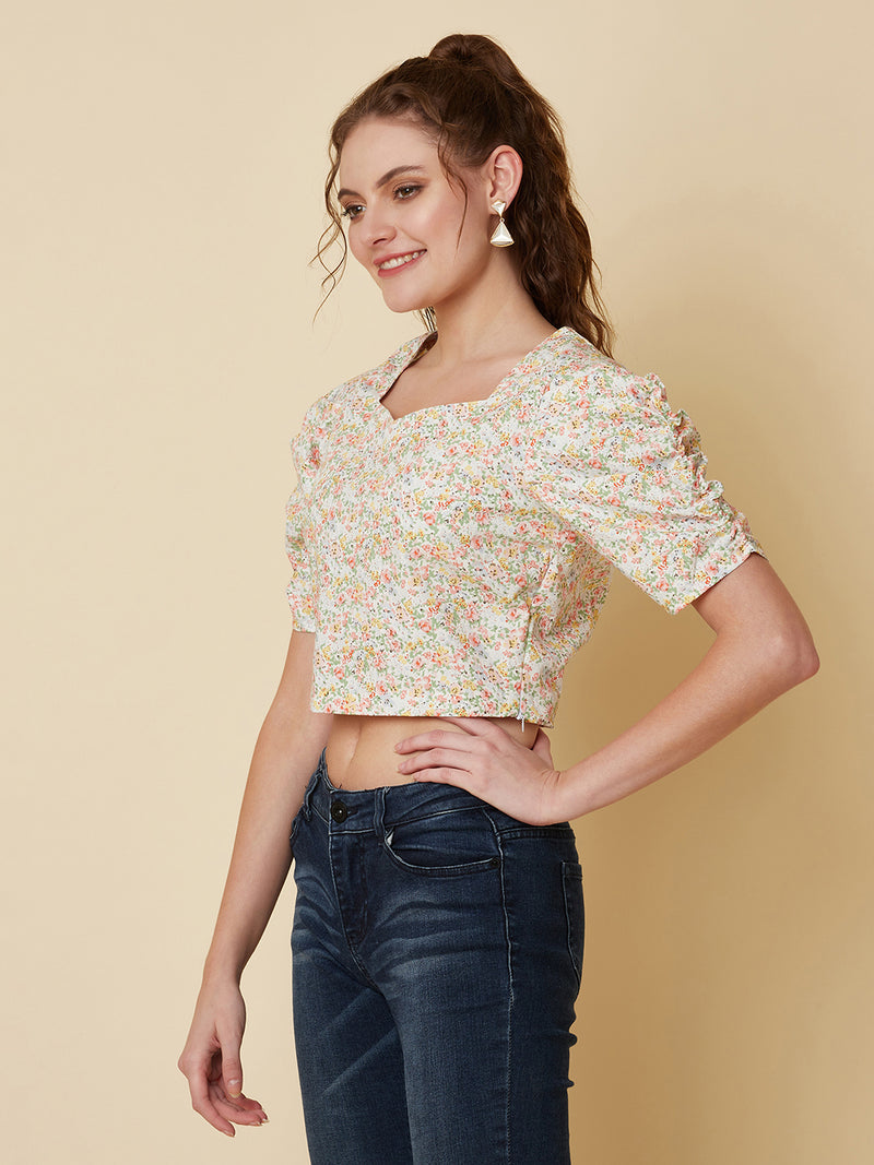 This Cotton Printed crop top for women is a versatile pieces of clothing that can be dressed on casual days. It can be worn with high-waisted skirts, shorts, or pants for a trendy and fashionable look.  Material -100% Cotton  Short and Pleated Sleeve  Zip Closure at Side  All over Floral Print