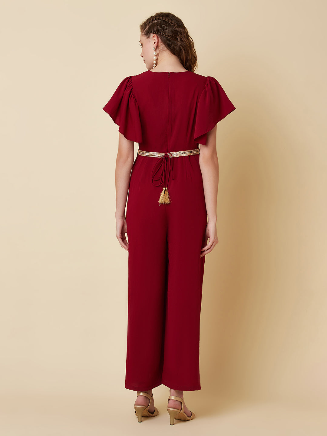 This Burgundy Color Solid Pleated Jumpsuit is perfect for any occasion, whether it be a day out shopping or a night out with friends.The pleated design adds a touch of sophistication and the wide leg pants are comfortable and easy to wear.
