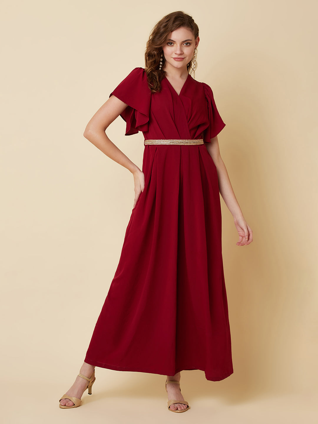 This Burgundy Color Solid Pleated Jumpsuit is perfect for any occasion, whether it be a day out shopping or a night out with friends.The pleated design adds a touch of sophistication and the wide leg pants are comfortable and easy to wear.