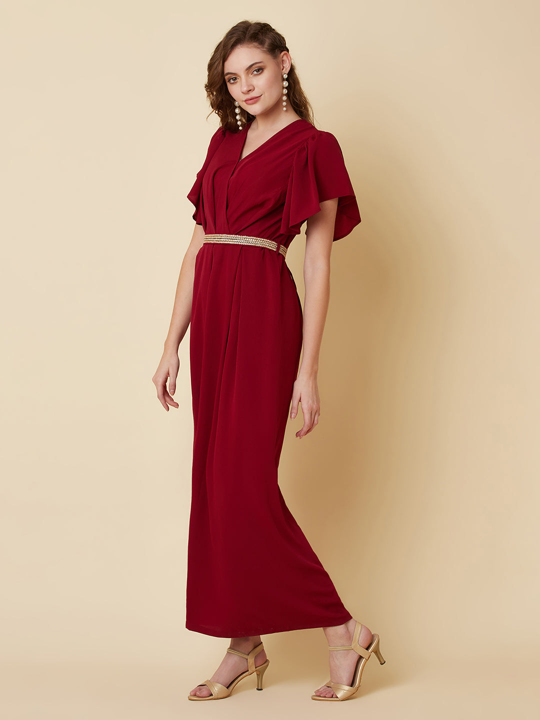 This Burgundy Color Solid Pleated Jumpsuit is perfect for any occasion, whether it be a day out shopping or a night out with friends.The pleated design adds a touch of sophistication and the wide leg pants are comfortable and easy to wear.