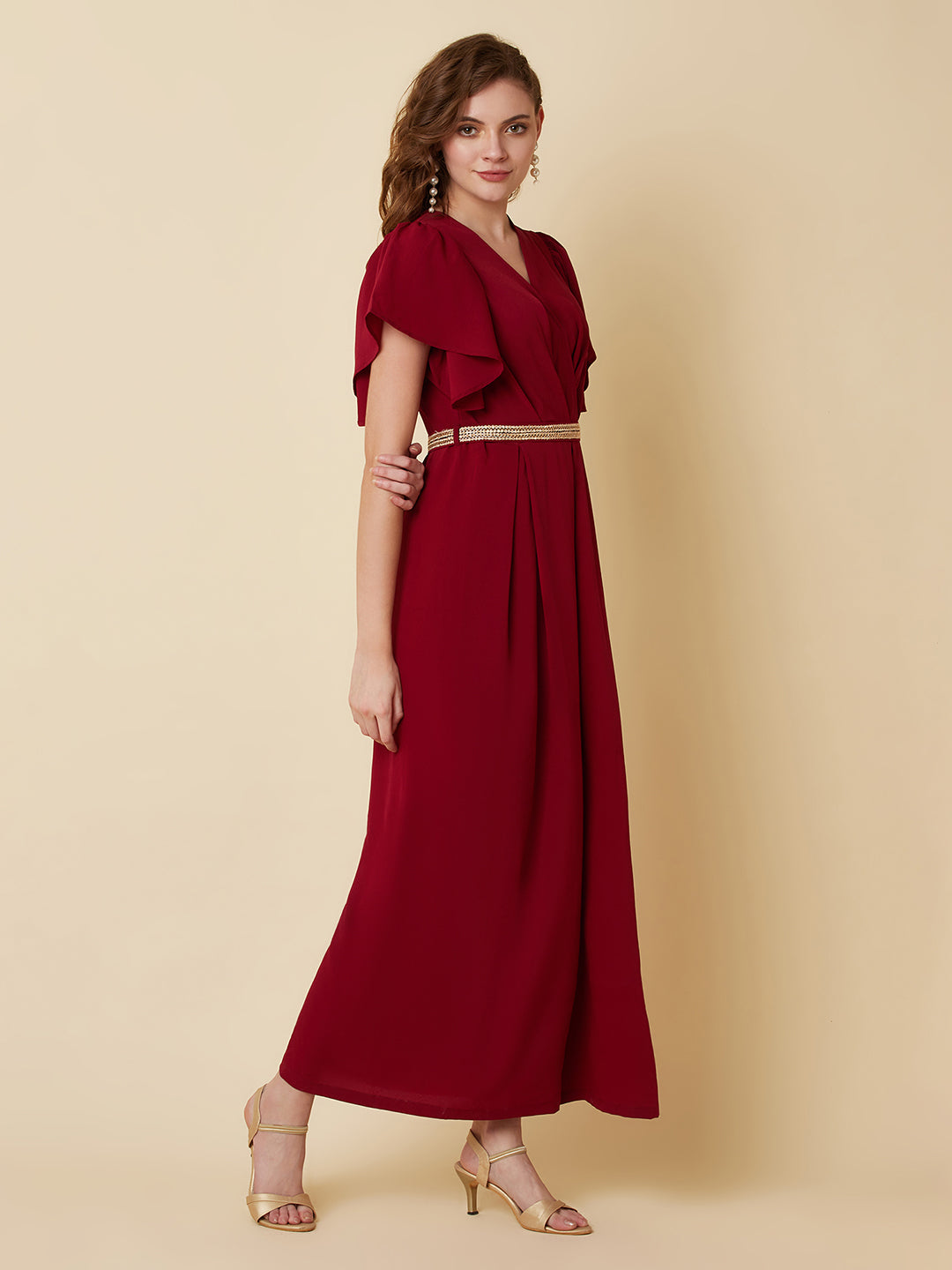 This Burgundy Color Solid Pleated Jumpsuit is perfect for any occasion, whether it be a day out shopping or a night out with friends.The pleated design adds a touch of sophistication and the wide leg pants are comfortable and easy to wear.