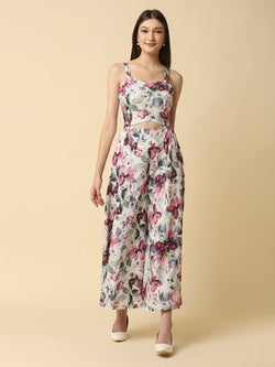 A fit and flare women floral jumpsuit with a waist cut is a stylish and trendy outfit that features a fitted bodice and a flared bottom. The waist cut creates a defined waistline, highlighting the curves of the body.