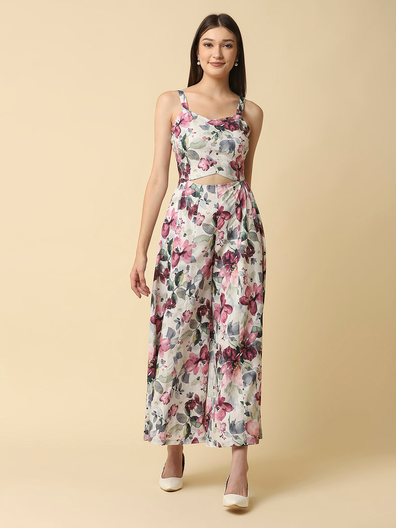 A fit and flare women floral jumpsuit with a waist cut is a stylish and trendy outfit that features a fitted bodice and a flared bottom. The waist cut creates a defined waistline, highlighting the curves of the body.